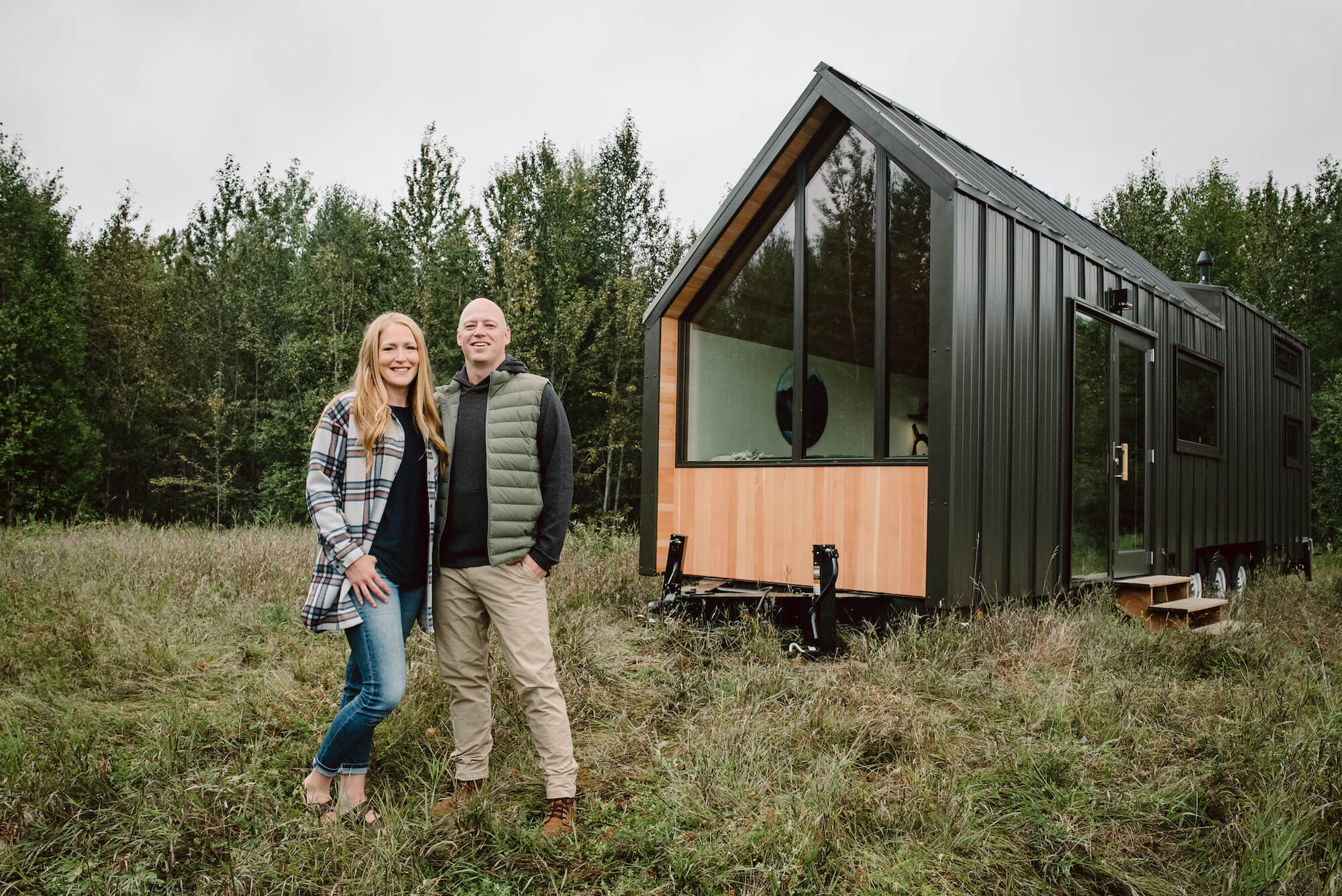 Heather and Kevin infront of tiny home