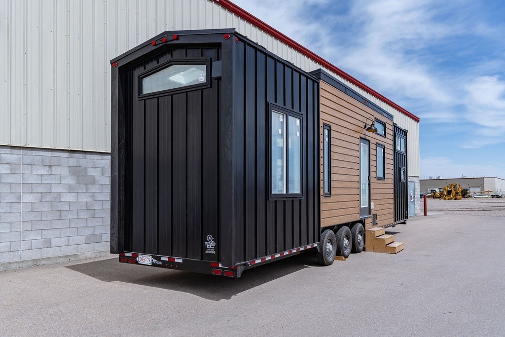 Black metal siding and cedar tng on tiny house on wheels