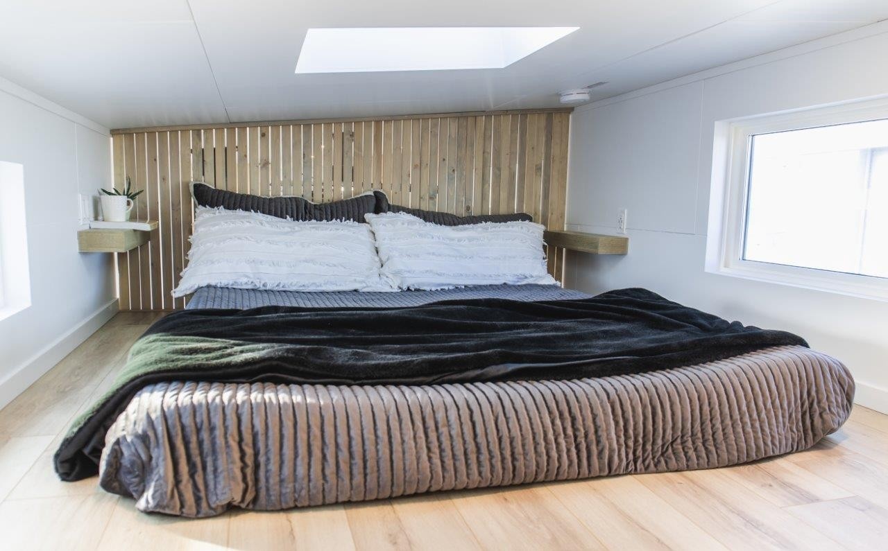 Tiny House on Wheels Loft with shelves and skylight