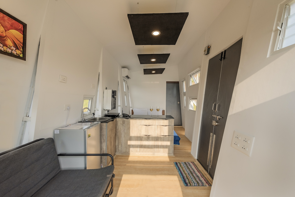 Tiny House Interior Design with white walls and natural cabinets